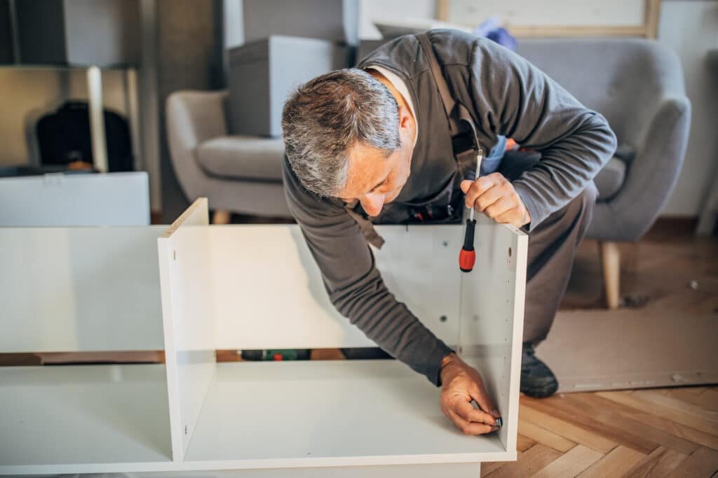 Handy Hive Pros technician assembling furniture for a homeowner, providing professional and hassle-free furniture assembly services.