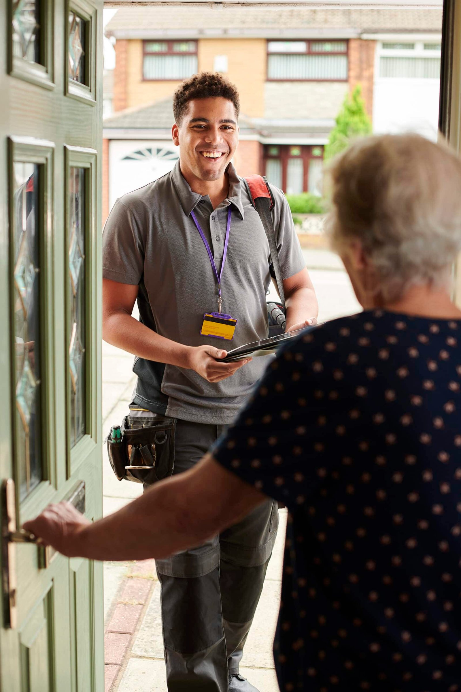 Handy Hive Pros handyman greeting a customer with a smile, ready to provide home repair and maintenance services.