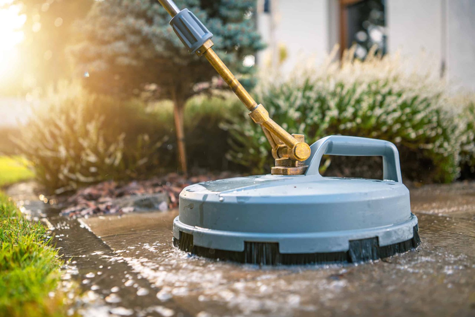 Professional pressure washer surface cleaner in action, removing dirt and grime from outdoor surfaces – Handy Hive Pros power washing services.